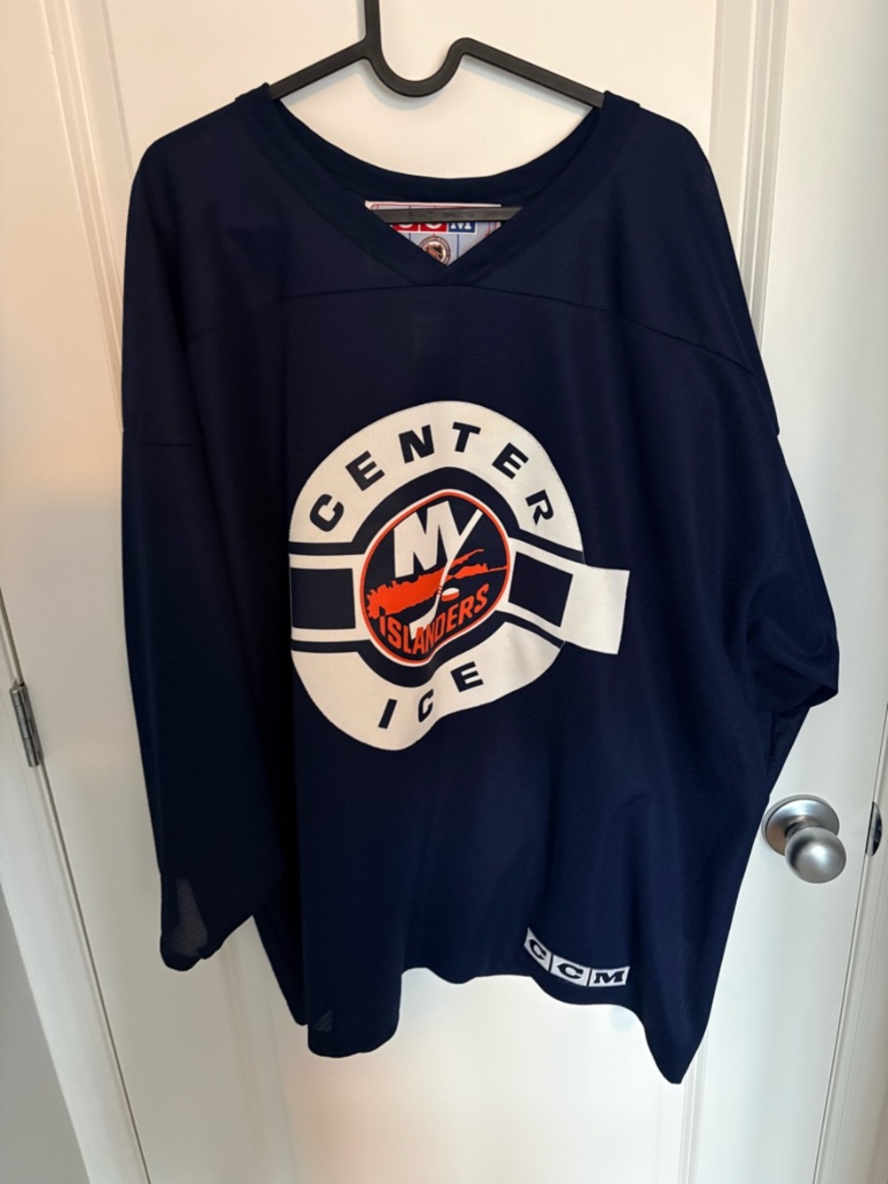 CCM Navy White Orange Hockey Jersey with Center Crest